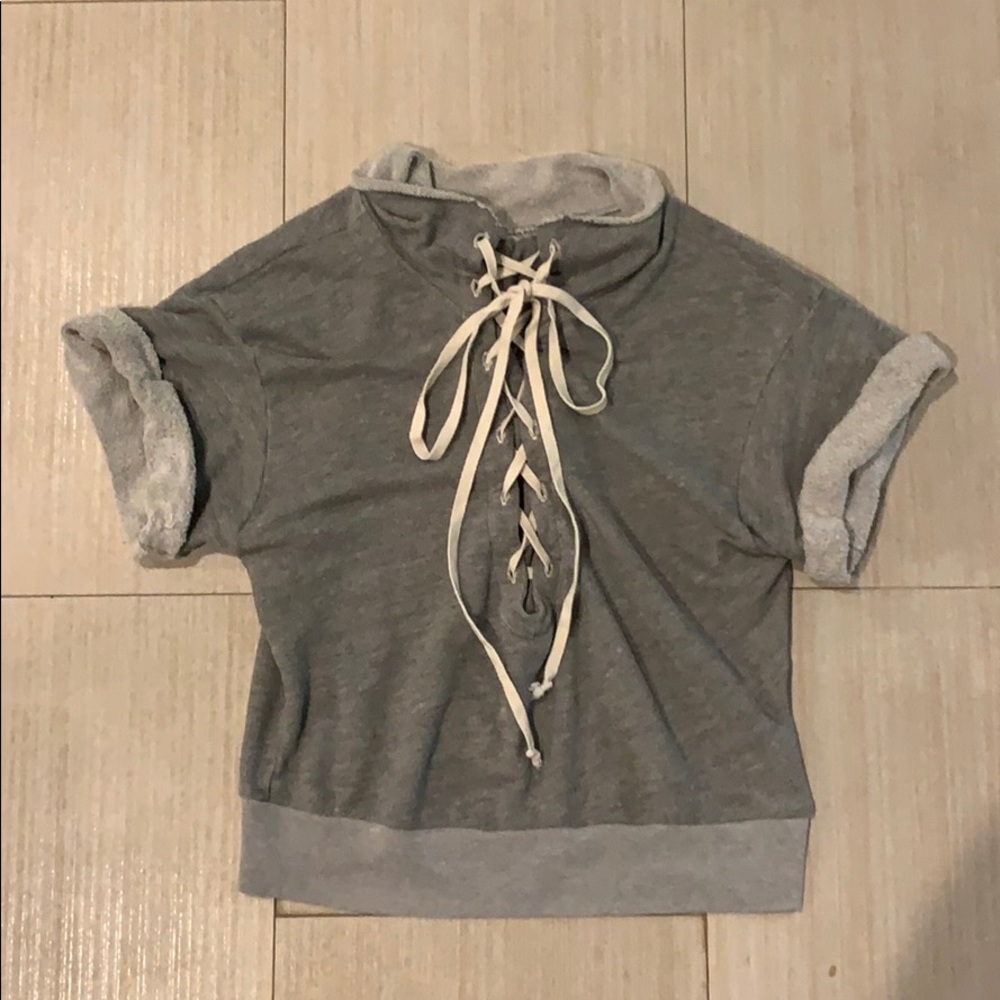 T. La terry cloth top with lace up front